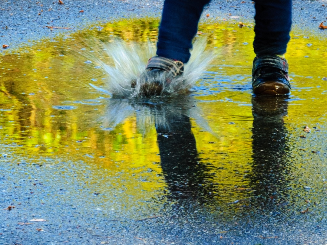 foot splashing in the rain